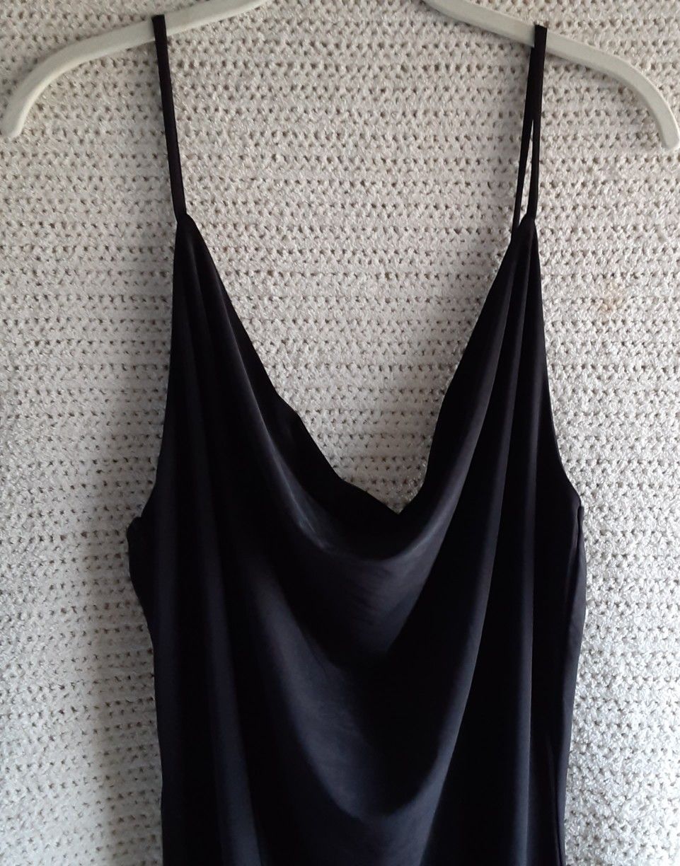 Black mini dress with drape front spaghetti straps in black.