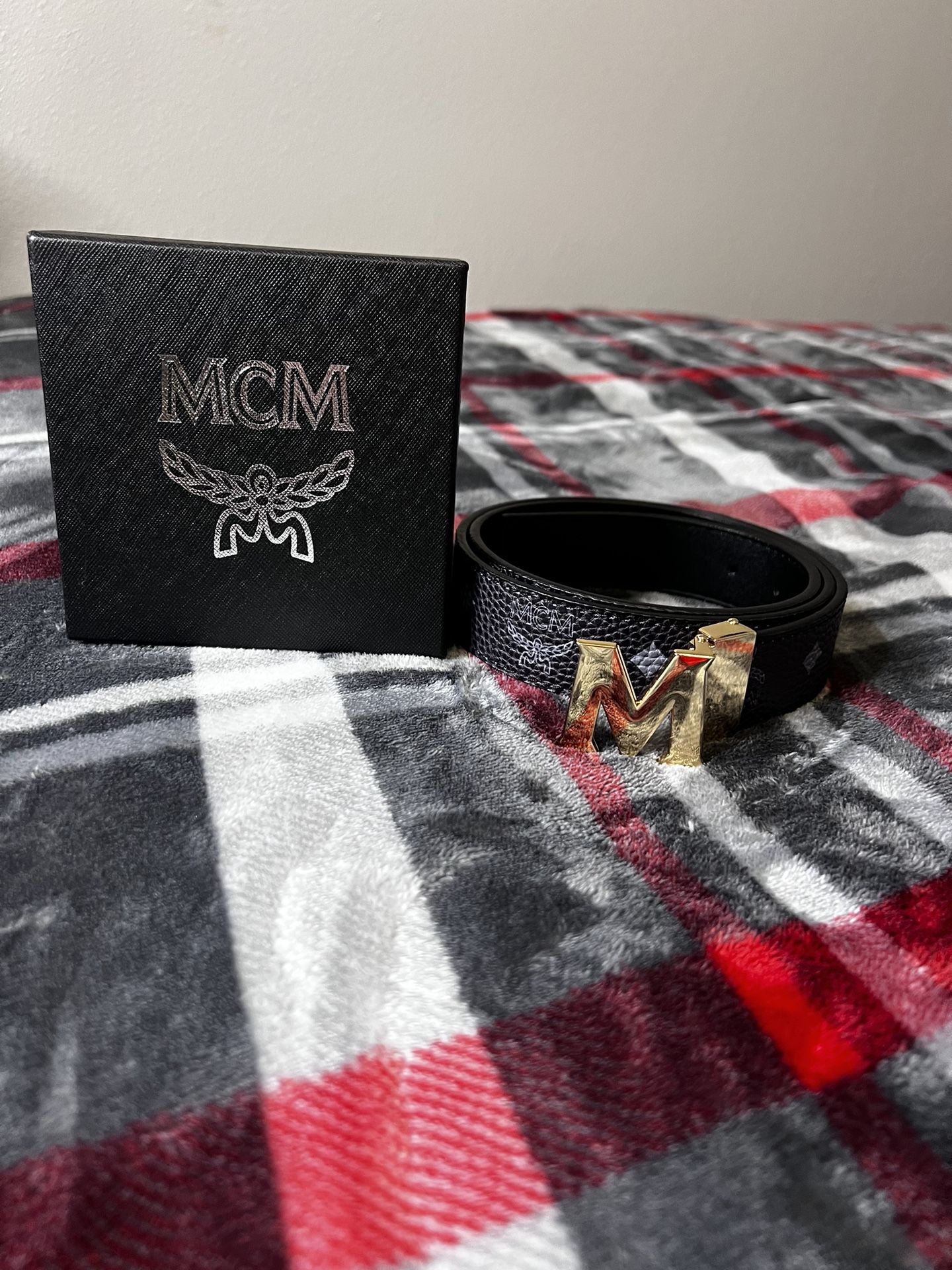 Masterful Elegance: MCM Black Belt Gold Buckle