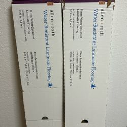 Box of Lowe’s Allen + Roth Laminated Floor