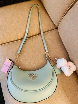 Beautiful Juicy Couture Frosty Green crescent cross body bag with gold hardware. New with tags!