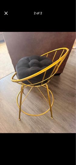 Gold tone swivel chair