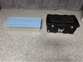 Storage boxes with lids. Foot locker with latches and wheels and larger (under the bed) storage box.