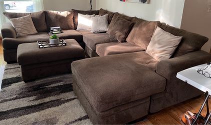 Brown sectional couch with ottoman