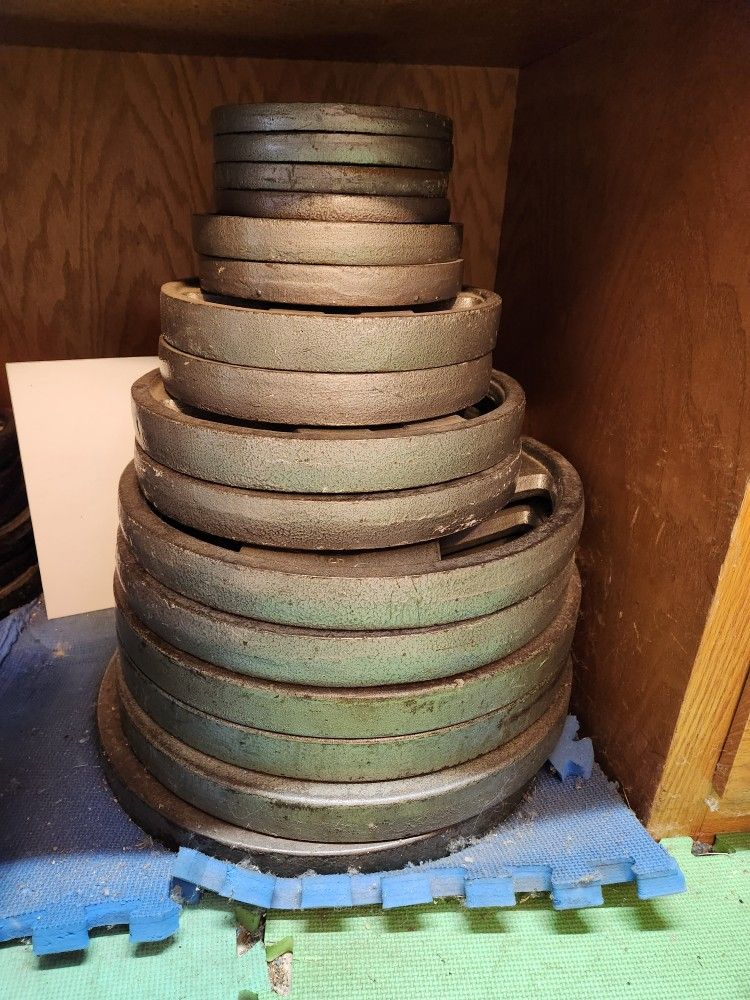 Olympic weight set with extra forty five lbs plates