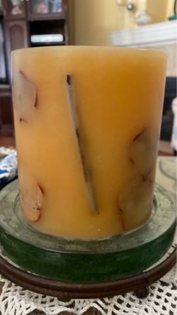 Yellow With Decorations Candle on Thick glass and metal stand.