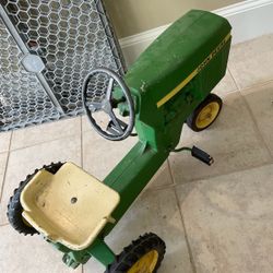 Vintage John Deere Child's peddle tractor. Metal , kinda Heavy Vintage