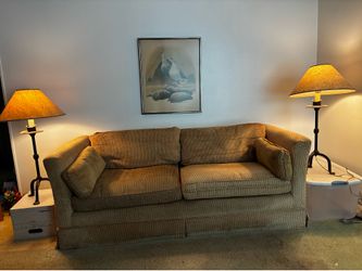 Golden yellow, textured couch with matching and lamps!