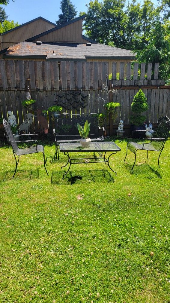 Wrought Iron Patio Glider With 2 Chairs And Coffee Table