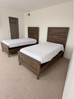 2 twin beds with mattress and box springs