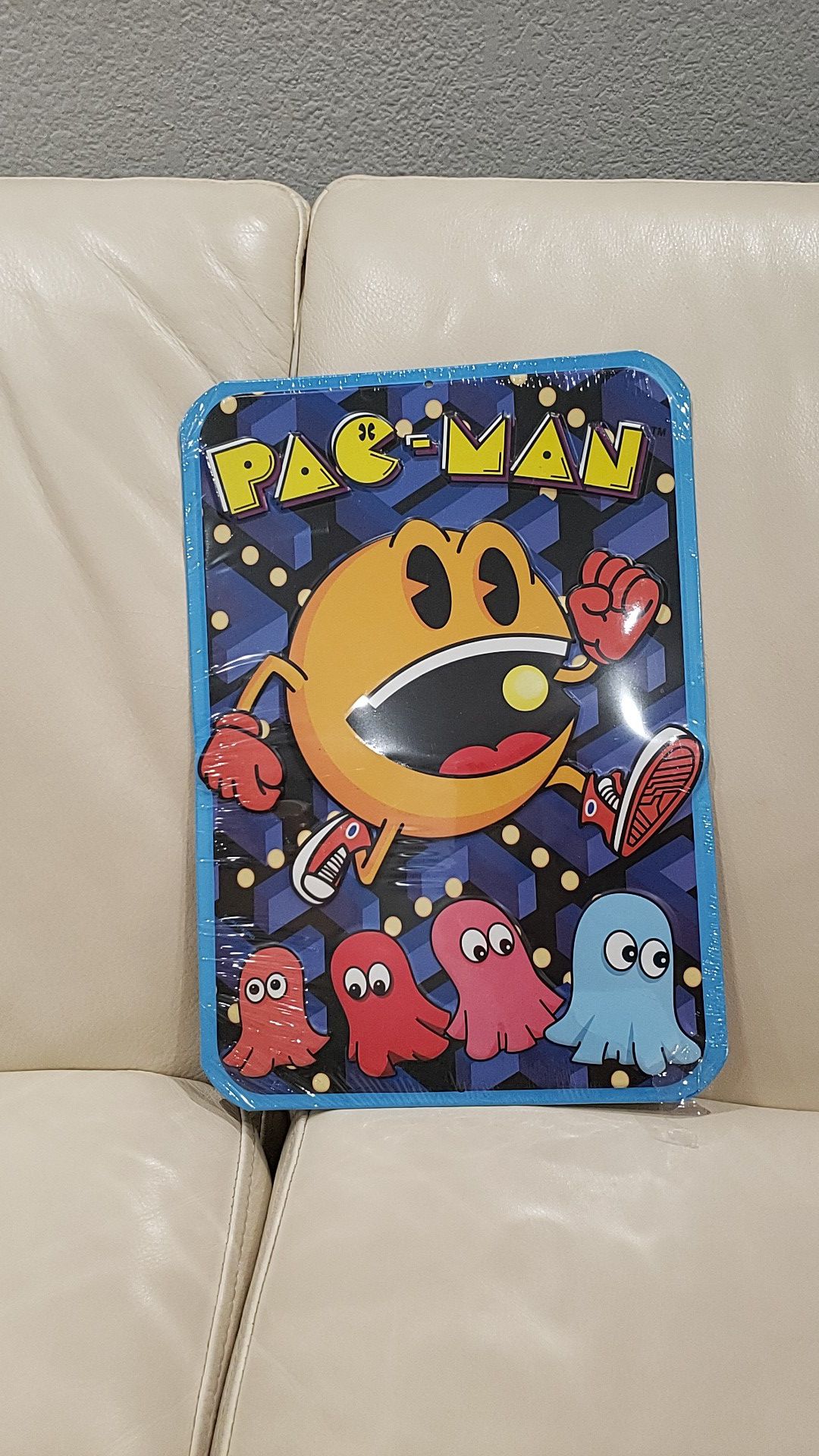 Pacman video game metal door wall sign measures 9x13" embossed metal brand new with hole at the top for easy hanging