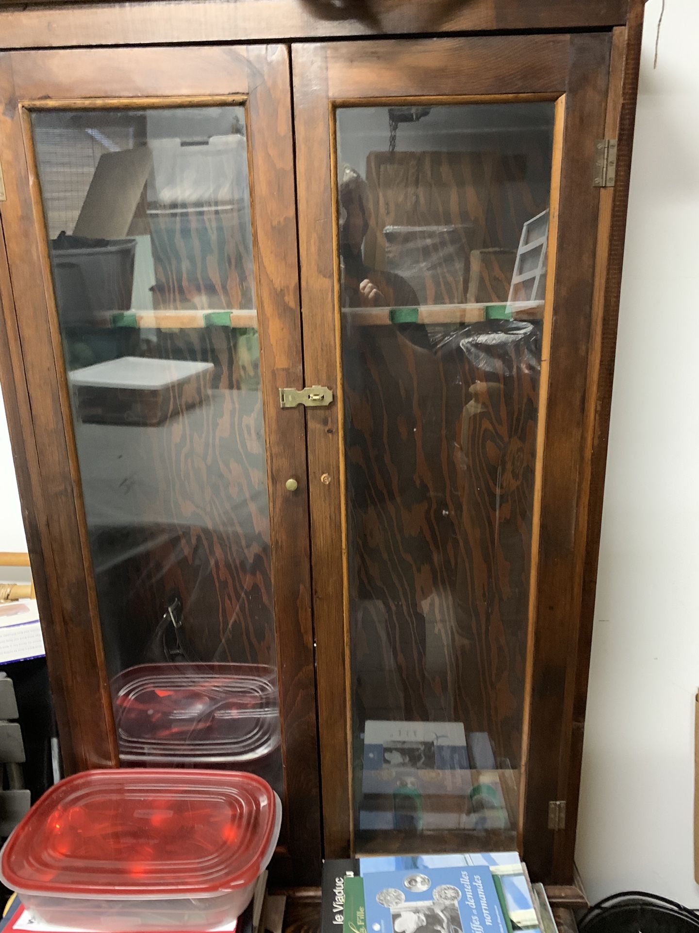 Gun cabinet with small storage cabinet on bottom of cabinet