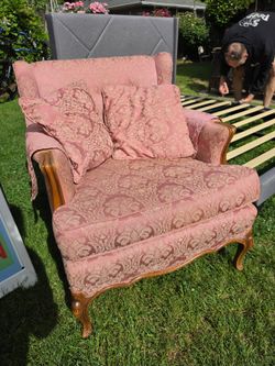 Absolutely adorable Pink antique arm chair
Makes you feel like your getting a hug from grandma! 
Has some typical vintage ware from use.