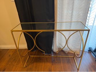 Console table with gold metal and mirror