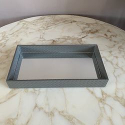 Mirrored vanity tray with grey faux leather. Lovely addition to your bathroom or boudoir
