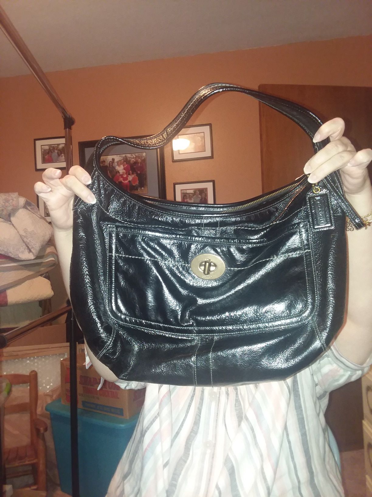 Black Leather Coach shoulder bag with turn key lock