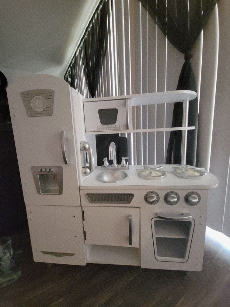 play kitchen with bag of play food