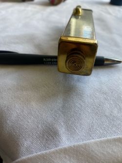 vintage Swift & Anderson surveyor's hand-held sighting level is used for measuring elevations and establishing horizontal lines.