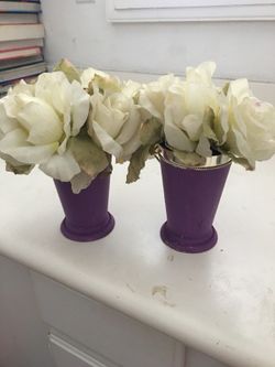 Purple vase with white flowers