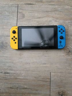 Nintendo Switch with Yellow and Blue Joy-Cons