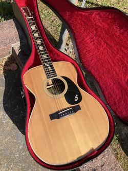 Sekova F2000 vintage, Japanese-made steel-string acoustic guitar from the late 1960s or early 1970s, often featuring an Orchestra Model (OM) body shap