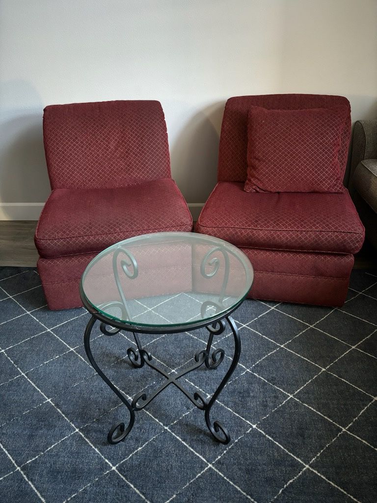 Two Armless Cushion Chairs and Glass Table