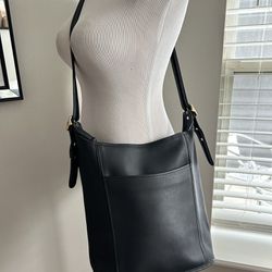 Designer woman’s black shoulder handbag by coach 13 x 13”