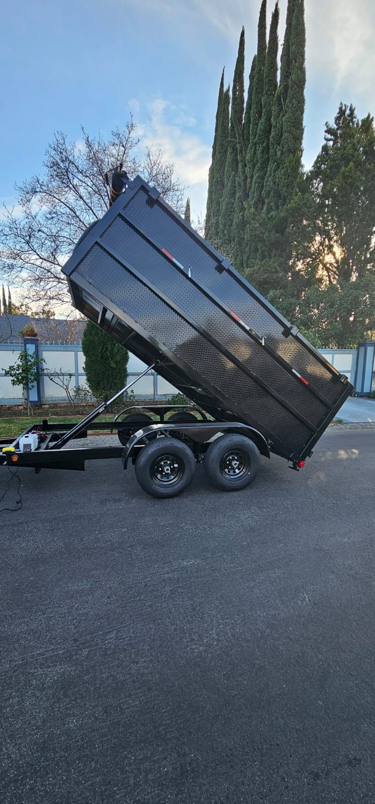 NEW DUMP TRAILER 12FT EQUIPPED ROLLING TARP AND SPARE TIRE REMOTE CONTROL ELECTRIC BRAKES LIGHTS,READY FOR WORK TITLE IN HAND FOR ANY QUESTION TEXT ME