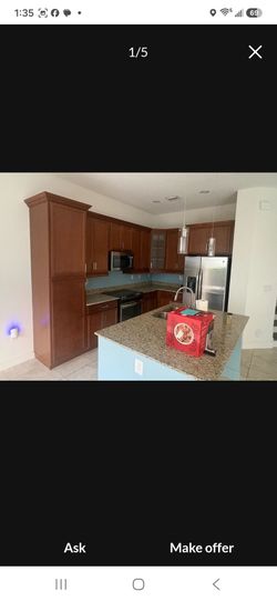 Brown Shaker cabinets a d granite counter top