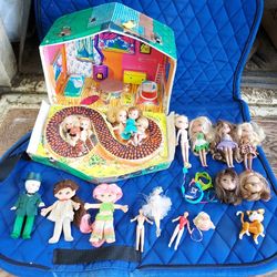 Collector dolls and 1 case