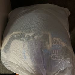 Trash bag full of different clothes 