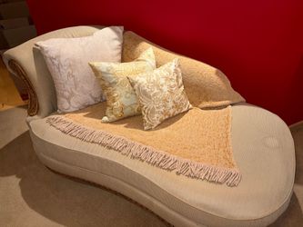 Elegant Chaise Lounge with Carved Wood Details