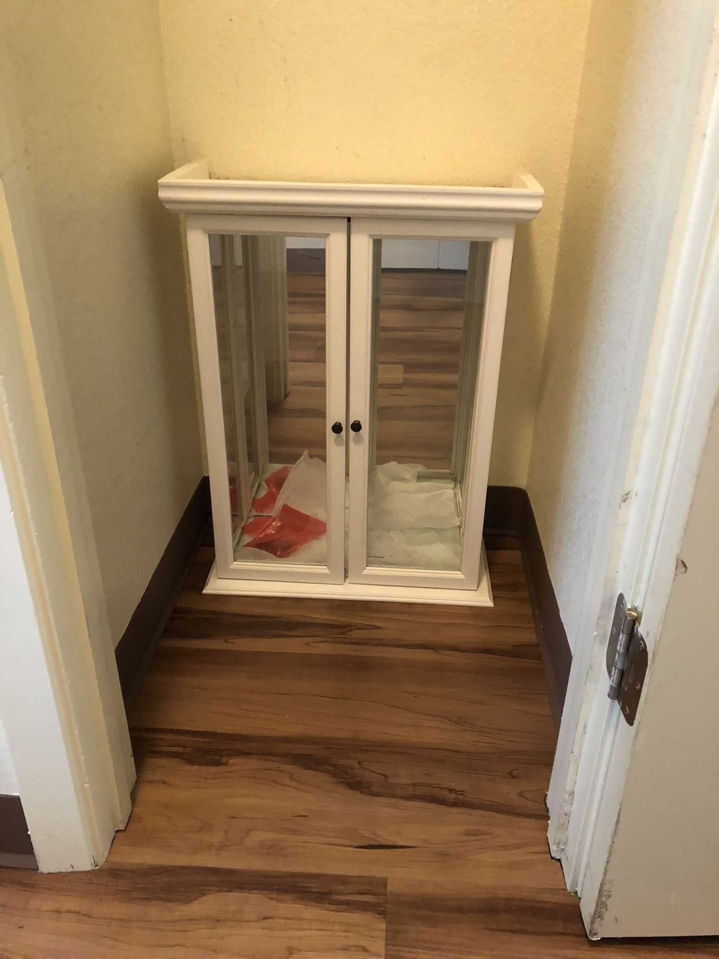 White display case with glass dividers