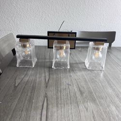 3 Light Black and Gold Bathroom Light Fixture like new