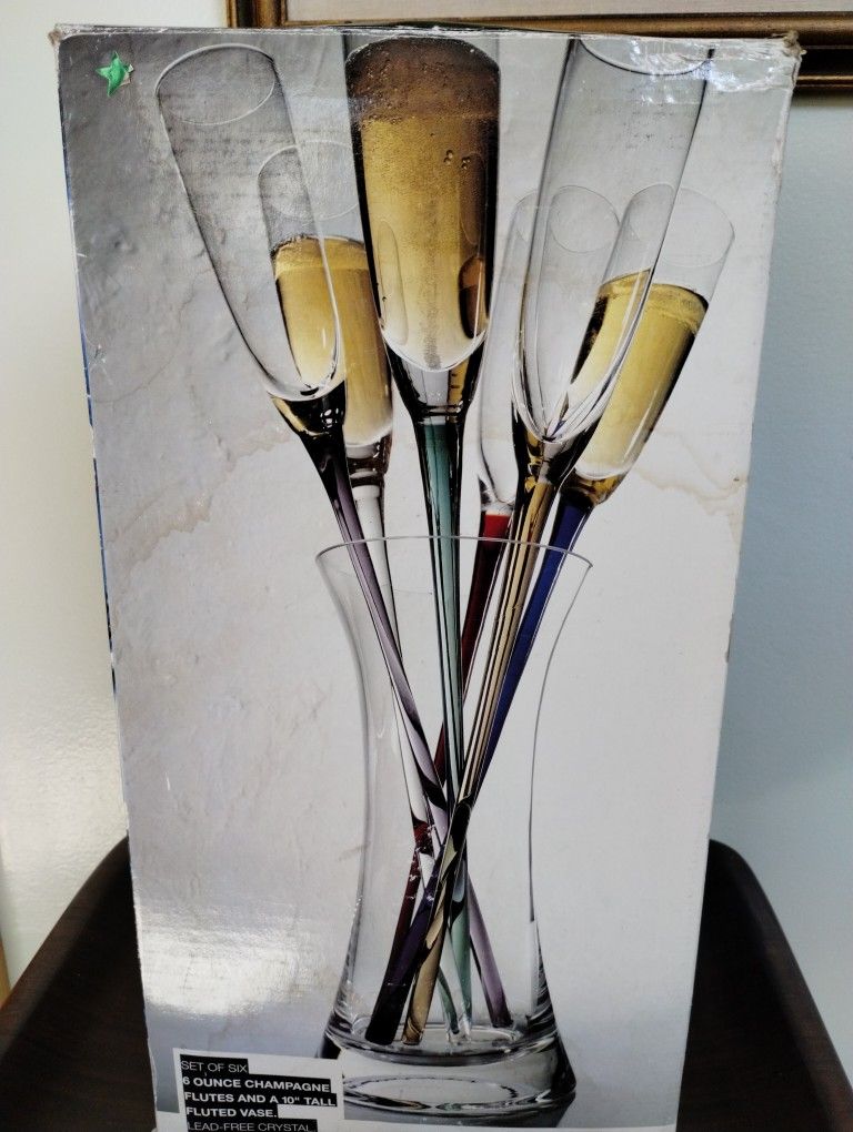 Set Of Six 6 Oz Champagne Flutes And A 10-in Tall Fluted Vase. Lead Free Crystal