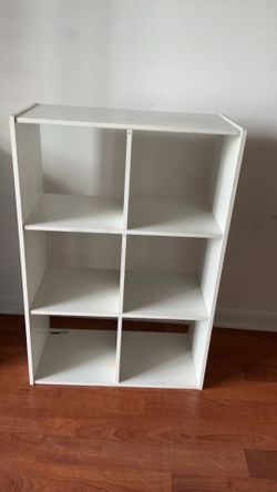 Moving sale white 6 cubby shelf a little wobbly however secure