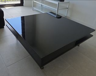 glossy black IKEA Tofteryd coffee table