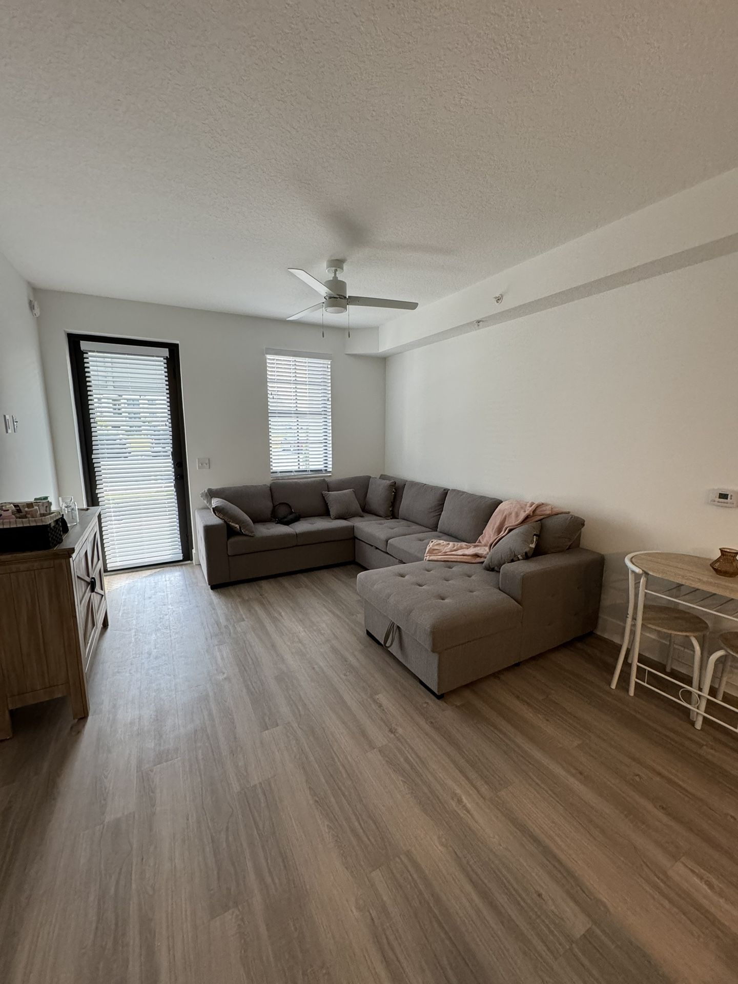 GRAY SLEEPER PULL OUT SOFA WITH STORAGE