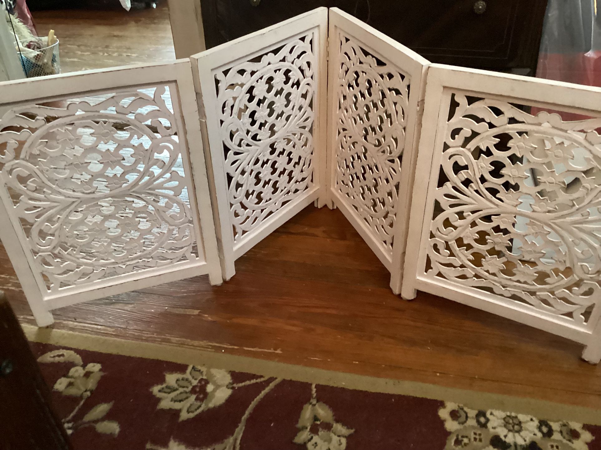 Folding Fence 4 Panels Carved White Purposely distressed Wood, each panel is 24” tall and 18” wide 
