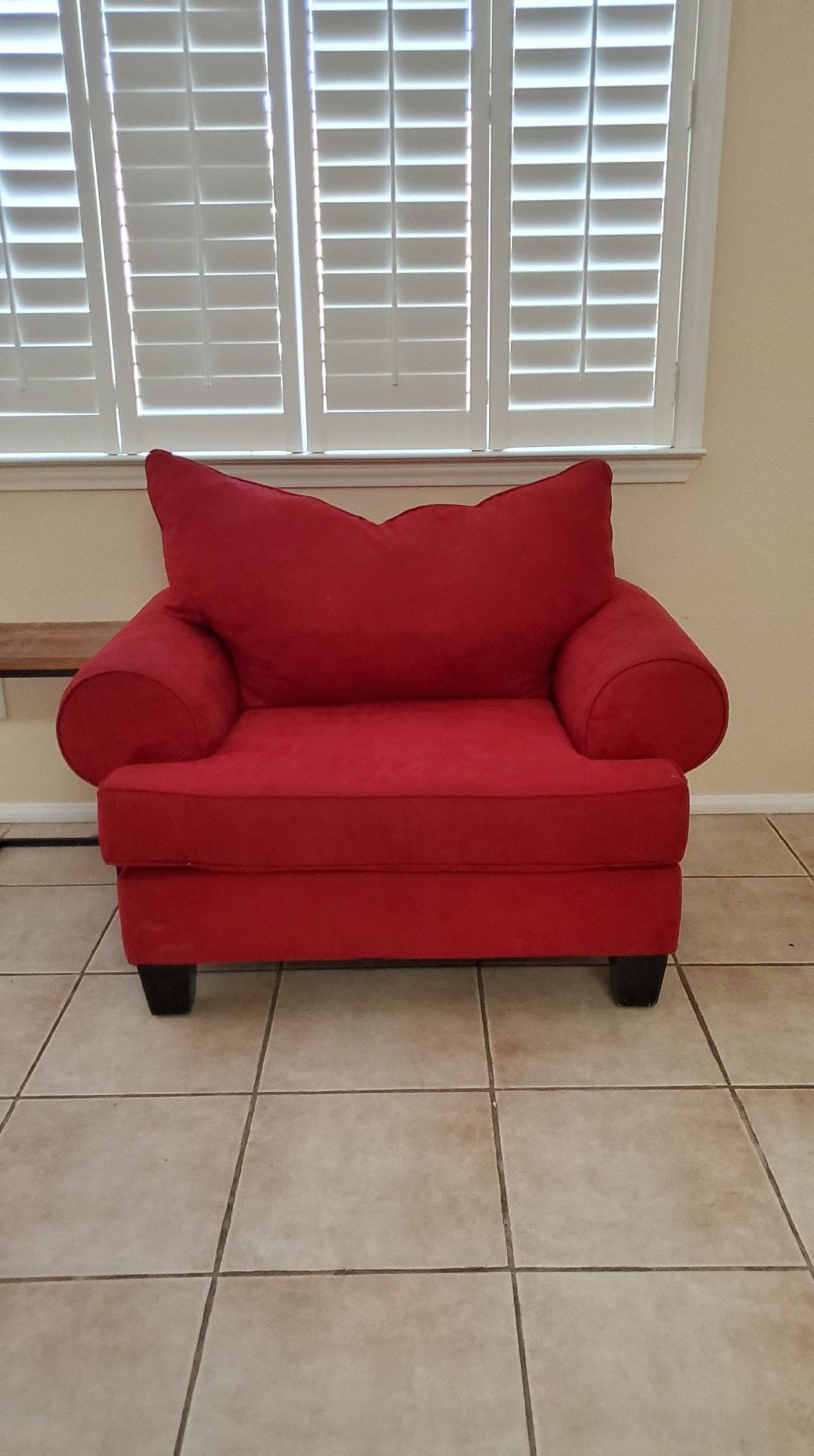 Red over stuffed chair