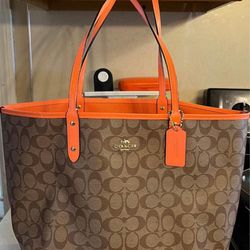 COACH reversible orange and brown logo bag