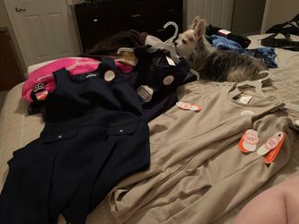 2 tan and 2 blue uniform dresses