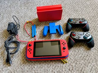 Limited Edition Mario Red And Blue Nintendo Switch Bundle - 2 Games & 4 Controllers