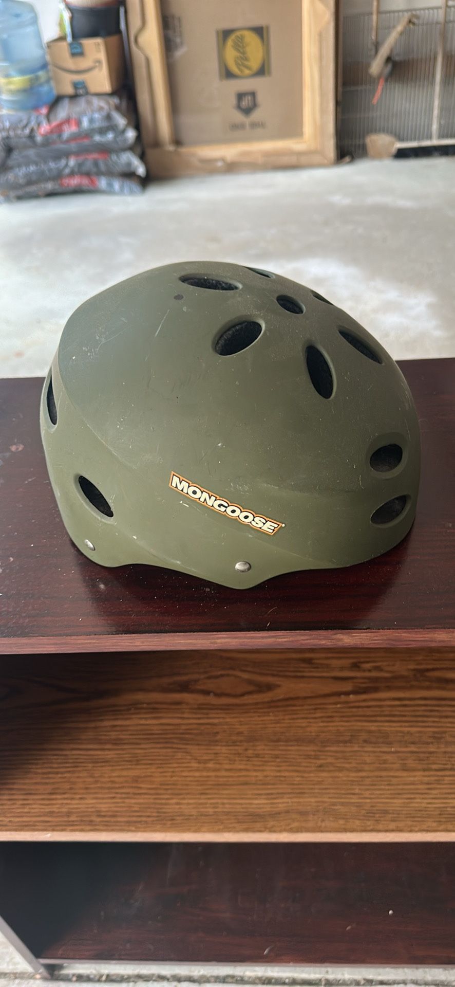 Green child size mongoose bike helmet