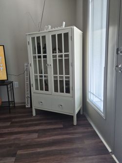 Nice cabinet, cream colored.
