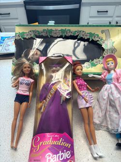 Four Barbies and one vintage dolls over $20