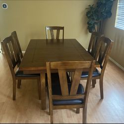 Brown Table With Six Chairs