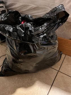 large trash bag full of clothes in good shape