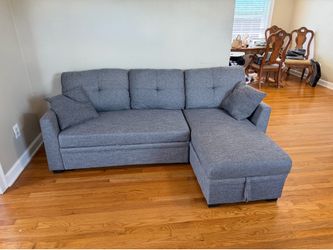 Grey Couch with storage and pull out bed
