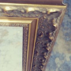 Classic golden color frame with mirror.