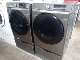 Samsung gray front load washer and dryer set on pedestals - Free delivery